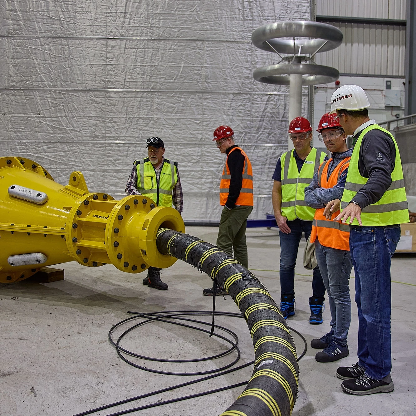 Testing Experts infront of Subsea Joint